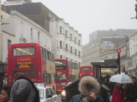 The lack of a bus station forces buses to clog up busy streets and passengers to wait on crowded pavements obstructing the flow of pedestrians as seen here in Brighton.