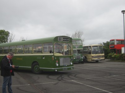 A preserved Eastern National Bristol RE in 'Tilling' livery moves forward to pick up passengers for one of the free bus trips into town.